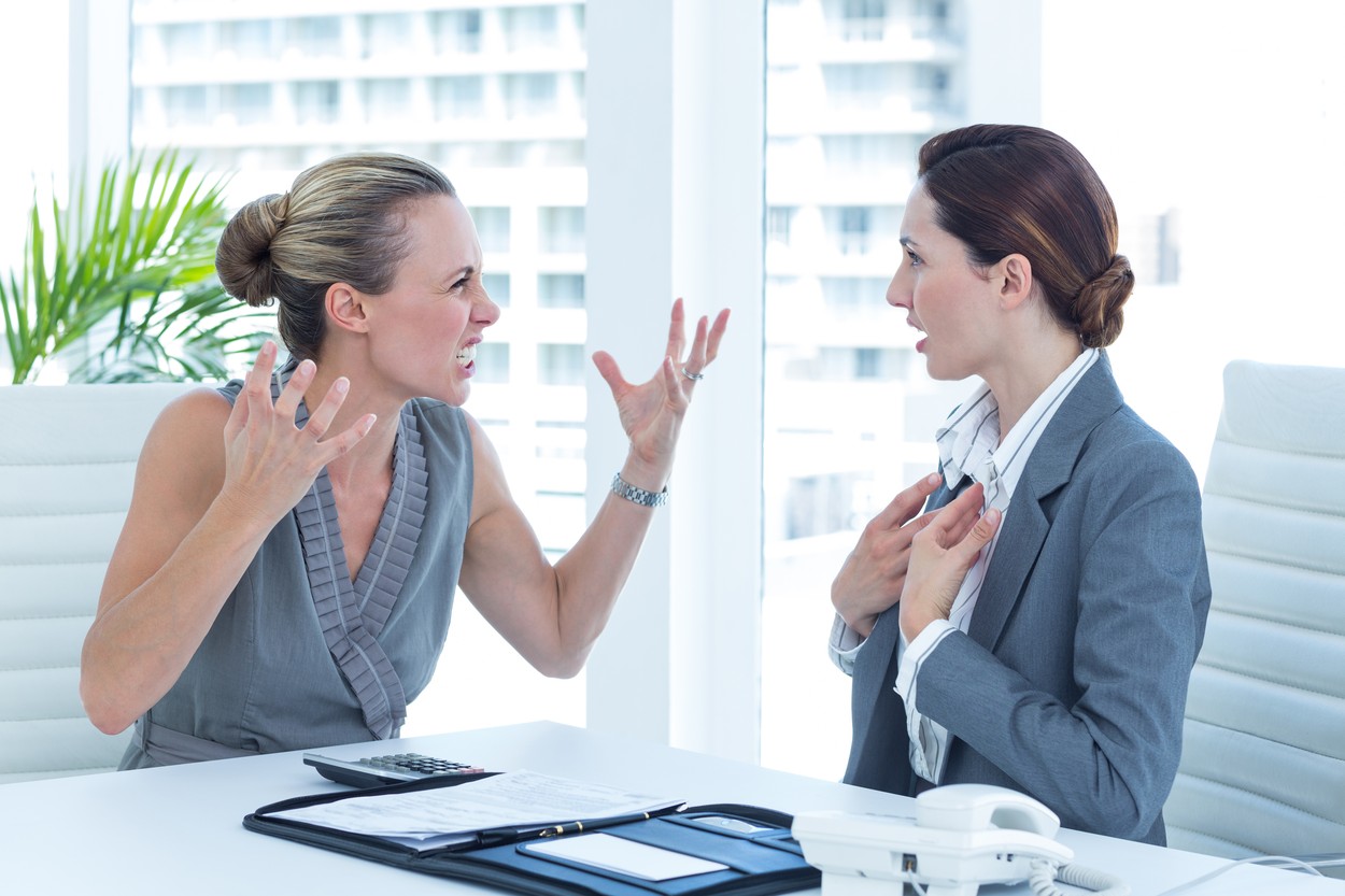 Businesswoman yelling at colleague