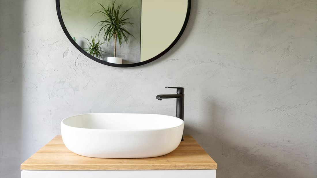 White,Washbasin,With,Faucet,On,Wooden,Countertop,In,Minimalist,Modern