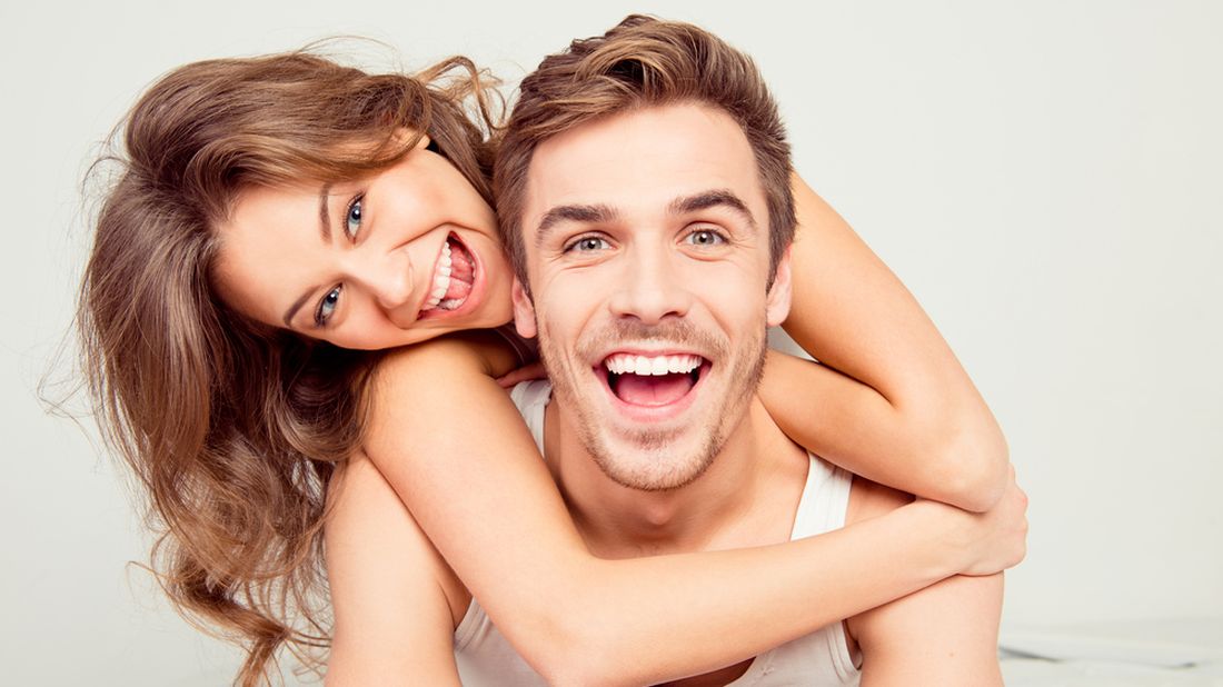 Cheerful,Smiling,Couple,In,Love,Hugging,In,The,Bedroom