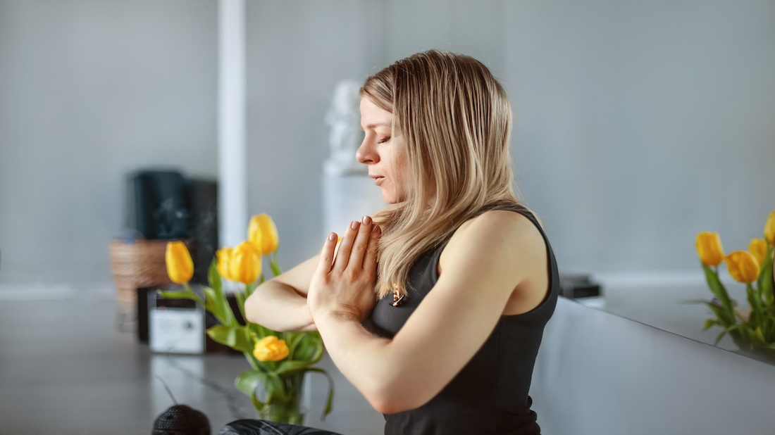 A beautiful young girl meditates after a yoga class. Rest, relaxation, healthy lifestyle